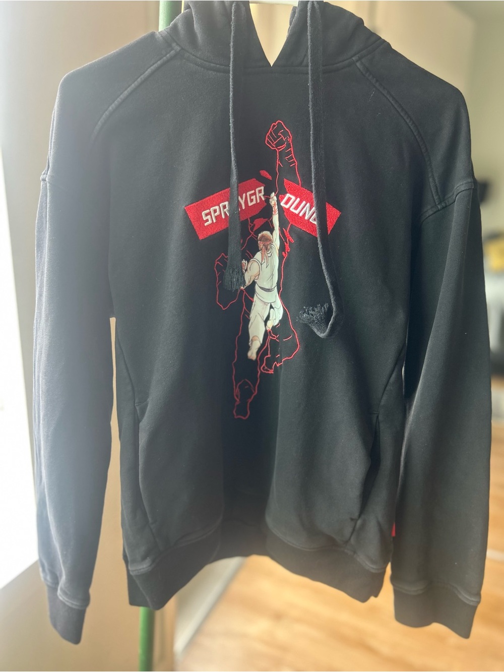 Sprayground Black Hoodie with Red Logo Tag